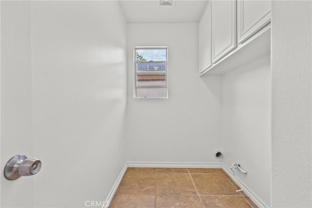27831 Silverton Ct, Valencia, CA 91354 - laundry room with cabinet space and baseboards