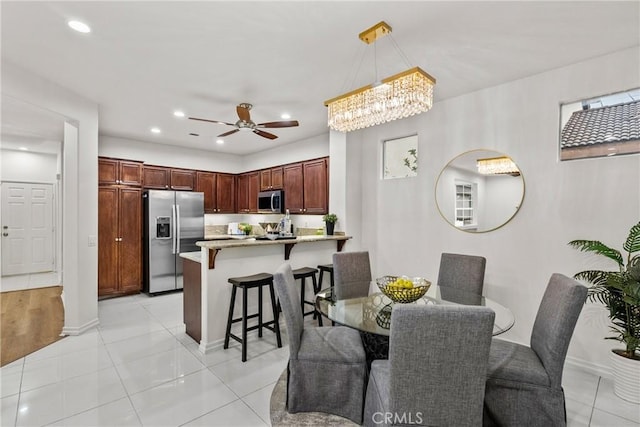 27831 Silverton Ct, Valencia, CA 91354 - dining space with a chandelier, light tile patterned floors, a ceiling fan, and recessed lighting