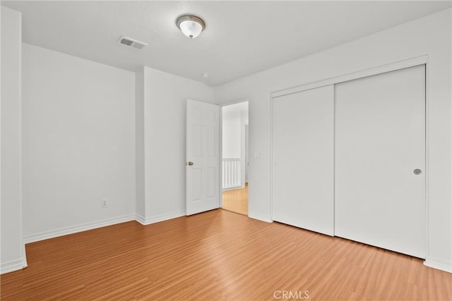 27831 Silverton Ct, Valencia, CA 91354 - unfurnished bedroom featuring wood finished floors and a closet