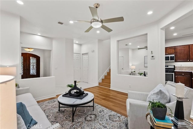 27831 Silverton Ct, Valencia, CA 91354 - living area featuring stairs, light wood-type flooring, recessed lighting, and ceiling fan
