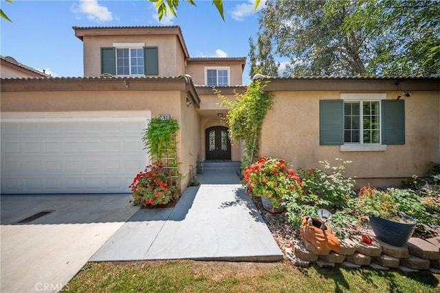 27831 Silverton Ct, Valencia, CA 91354 - mediterranean / spanish-style home featuring french doors, stucco siding, driveway, and a tiled roof