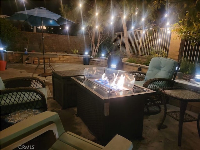 27831 Silverton Ct, Valencia, CA 91354 - patio at twilight featuring a fire pit and a patio area