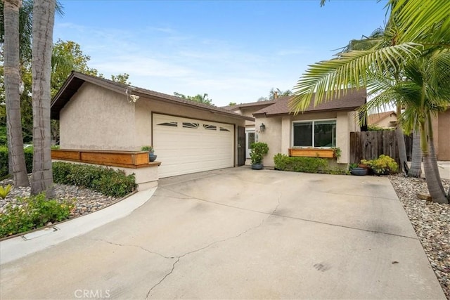 849 Shade Tree Ln, Fallbrook, CA 92028 - view of front facade featuring stucco siding, driveway, and an attached garage