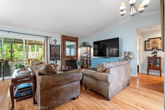 849 Shade Tree Ln, Fallbrook, CA 92028 - living room featuring a chandelier, vaulted ceiling, ornamental molding, light wood finished floors, and a brick fireplace