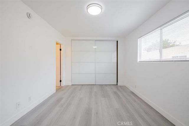 7741 Via Napoli Unit 77, Burbank, CA 91504 - unfurnished bedroom with light wood-style floors and a closet