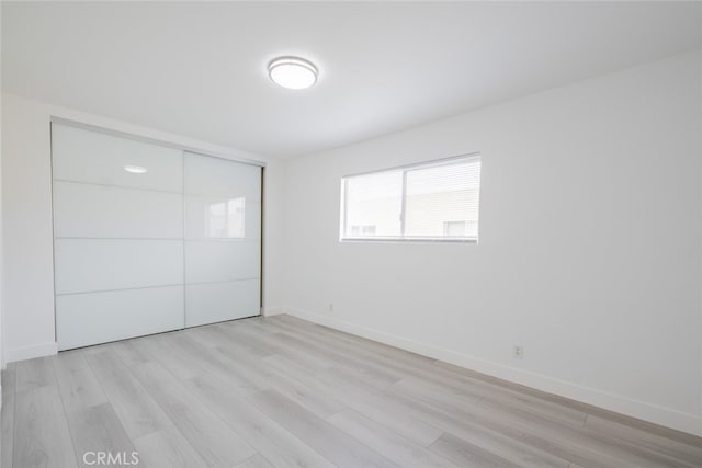 7741 Via Napoli Unit 77, Burbank, CA 91504 - unfurnished bedroom with light wood-type flooring and a closet