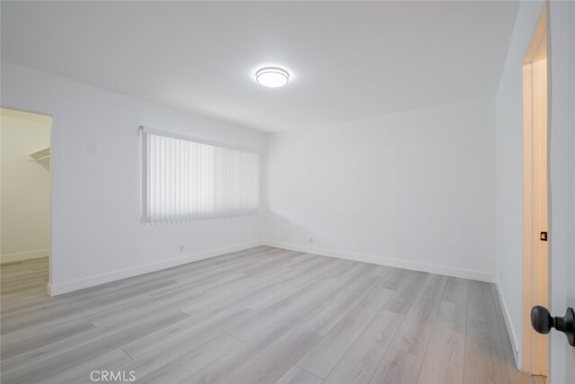 7741 Via Napoli Unit 77, Burbank, CA 91504 - unfurnished room featuring light wood-style floors and baseboards