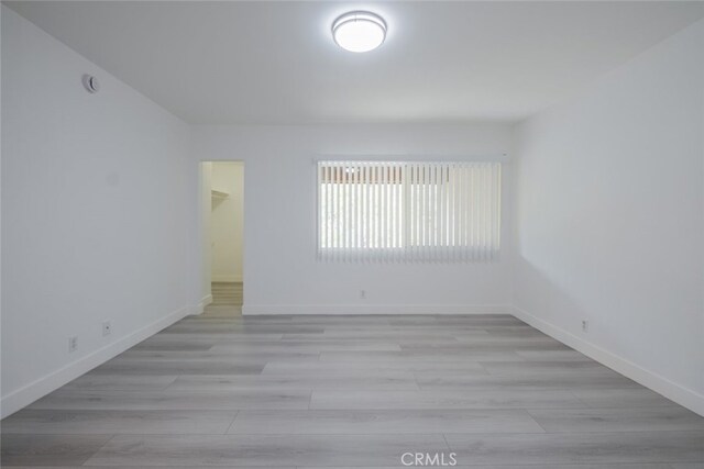 7741 Via Napoli Unit 77, Burbank, CA 91504 - empty room featuring baseboards and light wood-style floors
