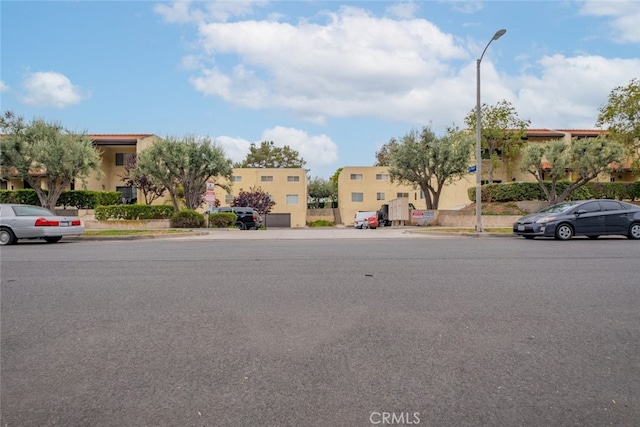 7741 Via Napoli Unit 77, Burbank, CA 91504 - view of asphalt street featuring sidewalks, street lighting, curbs, and a residential view
