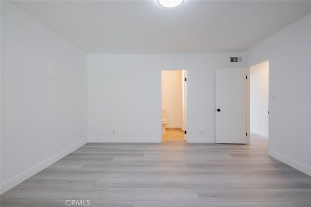 7741 Via Napoli Unit 77, Burbank, CA 91504 - unfurnished room with baseboards and light wood-style flooring