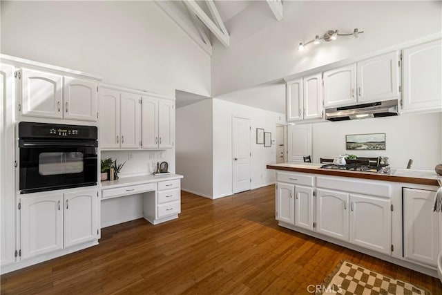 1720 N Cherry St, Chico, CA 95926 - kitchen with oven, under cabinet range hood, a high ceiling, white cabinetry, and stainless steel gas cooktop