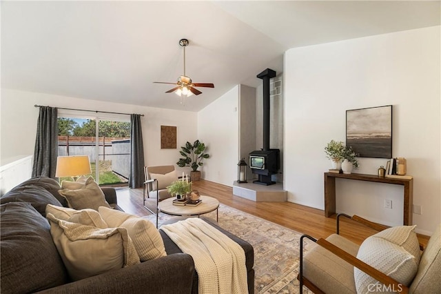 1720 N Cherry St, Chico, CA 95926 - living area with a ceiling fan, light wood-type flooring, lofted ceiling, and a wood stove