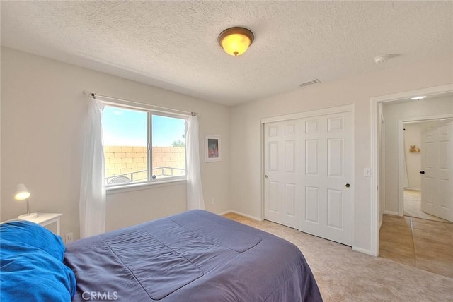 8250 Snow Cap Ave, Pinon Hills, CA 92372 - bedroom featuring carpet, a closet, baseboards, and a textured ceiling
