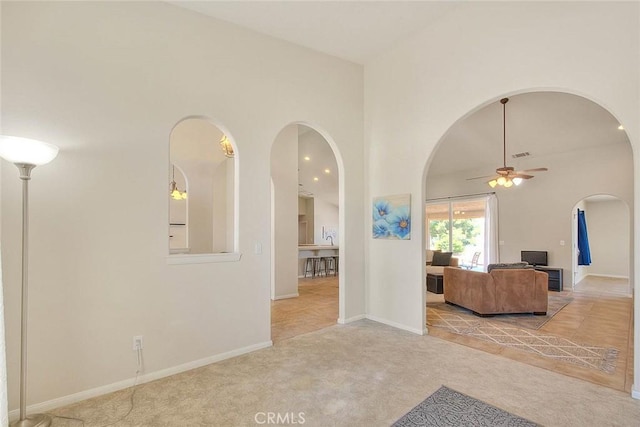 8250 Snow Cap Ave, Pinon Hills, CA 92372 - carpeted living room with arched walkways, ceiling fan, baseboards, a towering ceiling, and recessed lighting