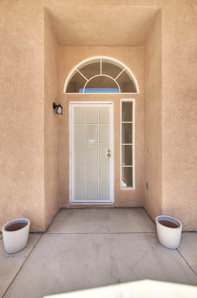 8250 Snow Cap Ave, Pinon Hills, CA 92372 - view of exterior entry with stucco siding