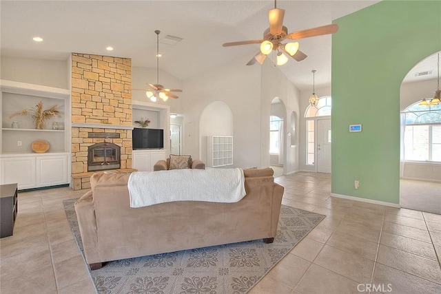 8250 Snow Cap Ave, Pinon Hills, CA 92372 - living area with arched walkways, a ceiling fan, light tile patterned floors, built in features, and recessed lighting