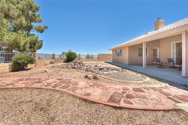 8250 Snow Cap Ave, Pinon Hills, CA 92372 - fenced backyard featuring a patio