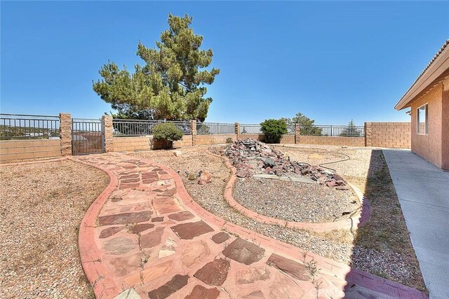 8250 Snow Cap Ave, Pinon Hills, CA 92372 - fenced backyard with a gate