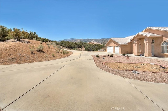 8250 Snow Cap Ave, Pinon Hills, CA 92372 - view of concrete driveway with a mountain view