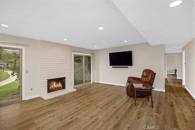 27262 Via Callejon Unit B, San Juan Capistrano, CA 92675 - living area featuring light wood-style floors, a fireplace, and recessed lighting