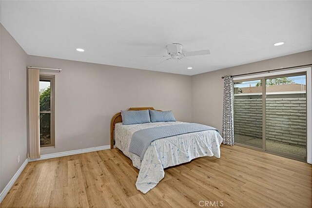 27262 Via Callejon Unit B, San Juan Capistrano, CA 92675 - bedroom featuring light wood-type flooring, multiple windows, recessed lighting, and access to exterior