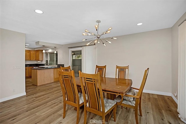 27262 Via Callejon Unit B, San Juan Capistrano, CA 92675 - dining room featuring light wood finished floors, a chandelier, and recessed lighting