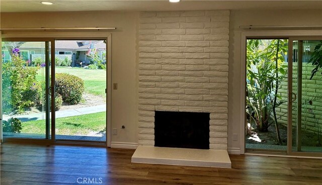27262 Via Callejon Unit B, San Juan Capistrano, CA 92675 - doorway featuring wood finished floors, recessed lighting, and a fireplace