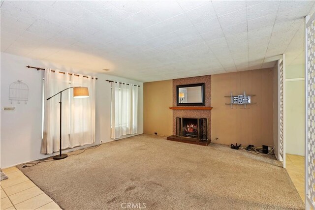 738 S Hollenbeck Ave, Covina, CA 91723 - unfurnished living room with a large fireplace and carpet floors