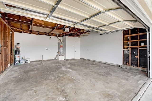 1024 E Dore St, West Covina, CA 91792 - garage featuring strapped water heater and a garage door opener