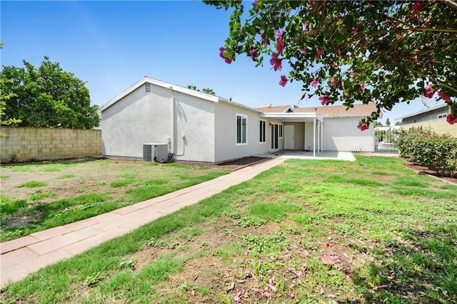 1024 E Dore St, West Covina, CA 91792 - rear view of property featuring central AC unit, stucco siding, and a patio