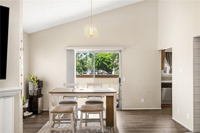 1206 S Cypress Ave Unit F, Ontario, CA 91762 - dining space featuring wood finished floors, a chandelier, high vaulted ceiling, and baseboards