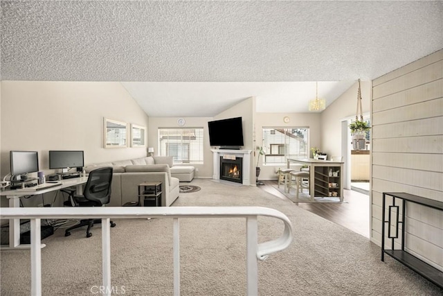 1206 S Cypress Ave Unit F, Ontario, CA 91762 - office with lofted ceiling, carpet flooring, a fireplace with flush hearth, and a textured ceiling