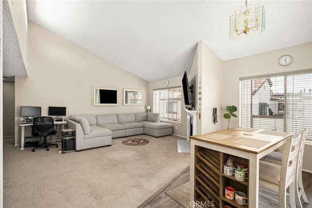 1206 S Cypress Ave Unit F, Ontario, CA 91762 - carpeted living area with a chandelier, vaulted ceiling, and an office area