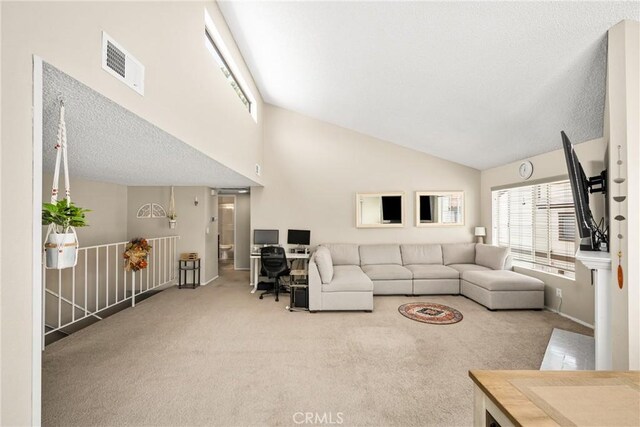 1206 S Cypress Ave Unit F, Ontario, CA 91762 - carpeted living area with high vaulted ceiling, baseboards, and a textured ceiling
