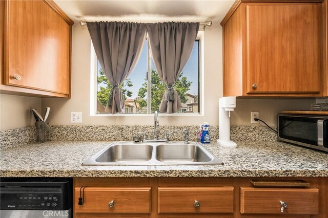 1206 S Cypress Ave Unit F, Ontario, CA 91762 - kitchen featuring appliances with stainless steel finishes, a sink, and brown cabinets