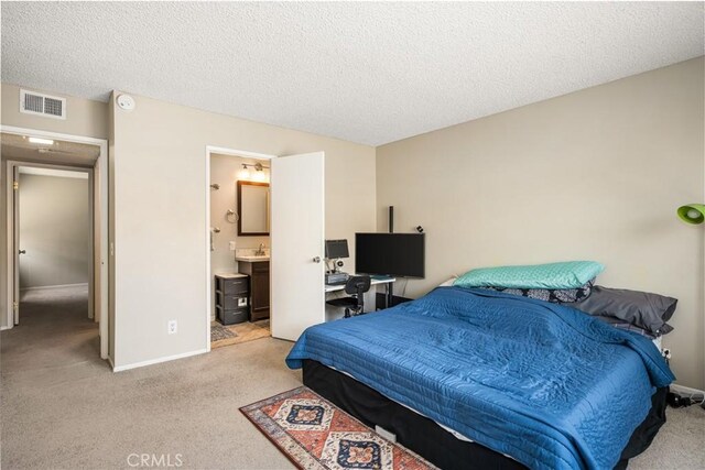 1206 S Cypress Ave Unit F, Ontario, CA 91762 - bedroom featuring light carpet, a textured ceiling, and baseboards