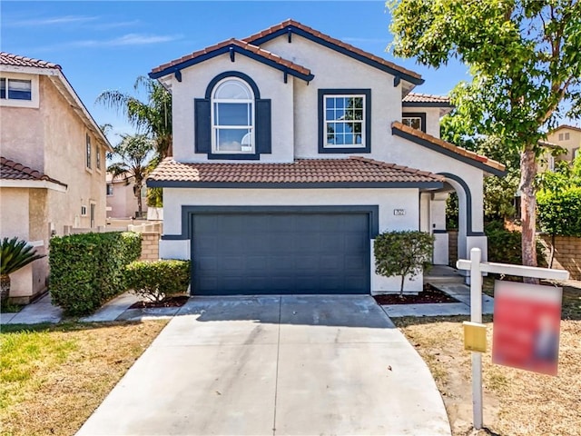 7522 Calais Ct, Rancho Cucamonga, CA 91730 - mediterranean / spanish house with a tiled roof, concrete driveway, stucco siding, and an attached garage