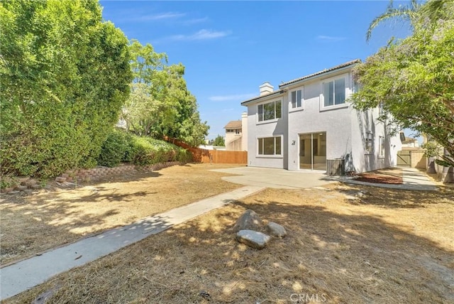 7522 Calais Ct, Rancho Cucamonga, CA 91730 - back of house with a patio area, a chimney, and stucco siding
