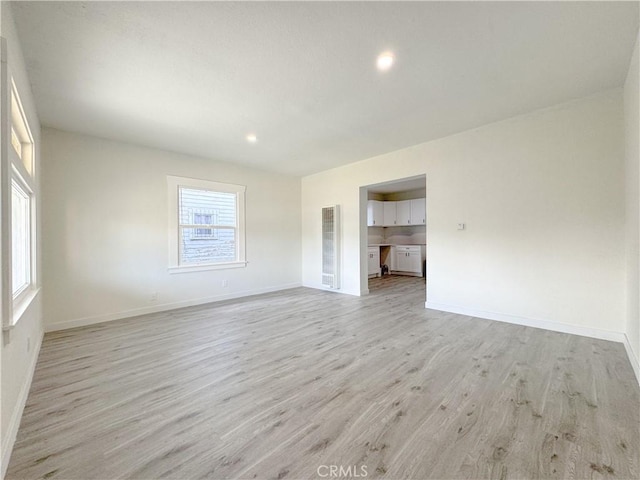 127 E 65th St, Los Angeles, CA 90003 - empty room with light wood-type flooring, baseboards, and recessed lighting