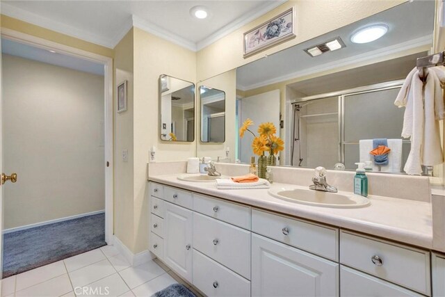 2160 Via Mariposa E Unit D, Laguna Woods, CA 92637 - full bath with double vanity, crown molding, a stall shower, tile patterned flooring, and baseboards