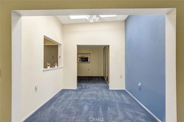 2160 Via Mariposa E Unit D, Laguna Woods, CA 92637 - hall with carpet, baseboards, and a skylight