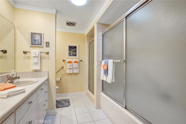 2160 Via Mariposa E Unit D, Laguna Woods, CA 92637 - bathroom featuring vanity, crown molding, toilet, tile patterned flooring, and baseboards
