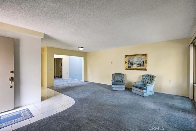 2160 Via Mariposa E Unit D, Laguna Woods, CA 92637 - unfurnished room featuring carpet floors, a textured ceiling, and tile patterned floors