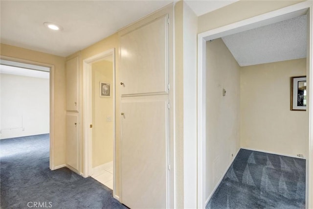 2160 Via Mariposa E Unit D, Laguna Woods, CA 92637 - corridor with dark colored carpet and baseboards