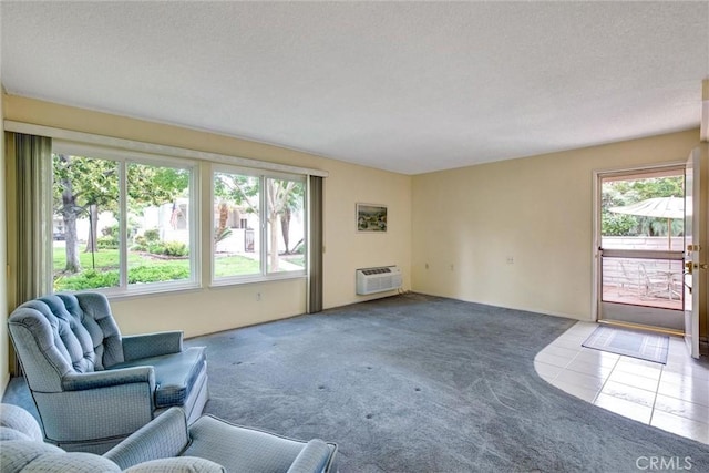 2160 Via Mariposa E Unit D, Laguna Woods, CA 92637 - unfurnished living room with carpet floors, a wall unit AC, tile patterned flooring, and a textured ceiling