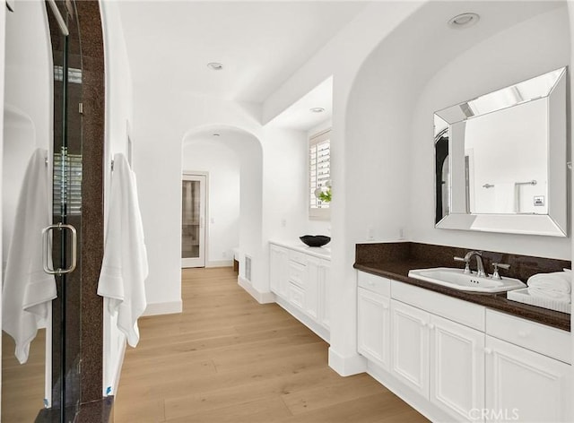 3 Seabluff, Newport Beach, CA 92660 - full bath with vanity, wood finished floors, a shower stall, and recessed lighting