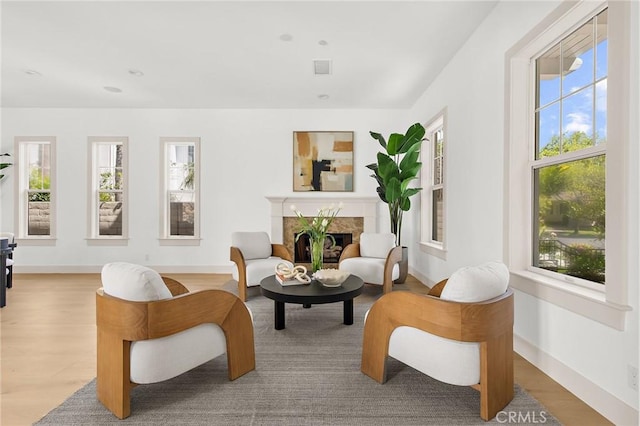 3 Seabluff, Newport Beach, CA 92660 - sitting room featuring a premium fireplace and wood finished floors