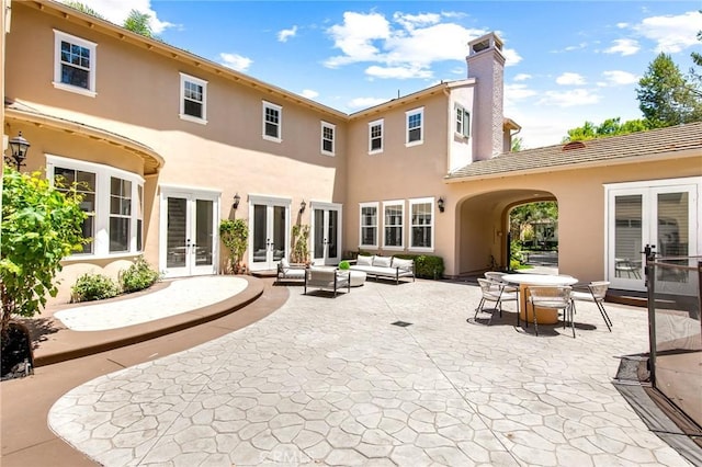 3 Seabluff, Newport Beach, CA 92660 - rear view of property with french doors, stucco siding, an outdoor hangout area, and a patio