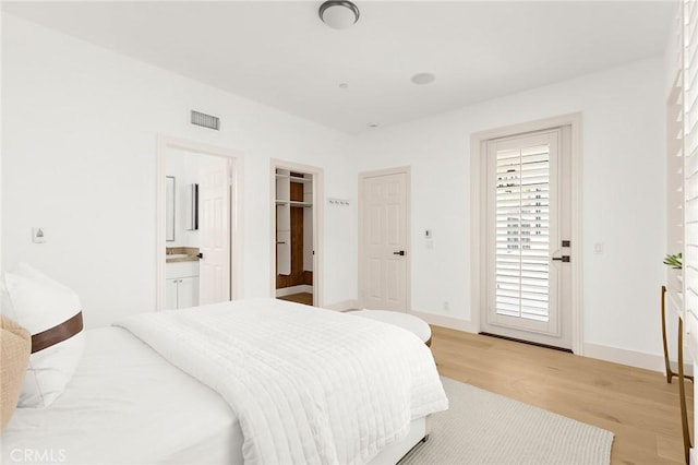 3 Seabluff, Newport Beach, CA 92660 - bedroom featuring light wood-style floors, access to exterior, and ensuite bathroom