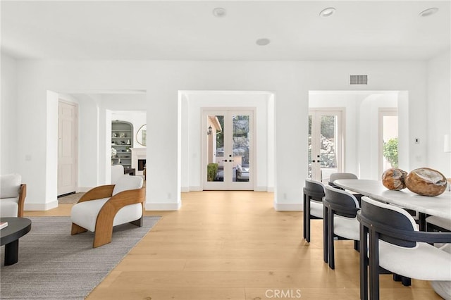 3 Seabluff, Newport Beach, CA 92660 - dining space featuring french doors, light wood-style floors, and recessed lighting